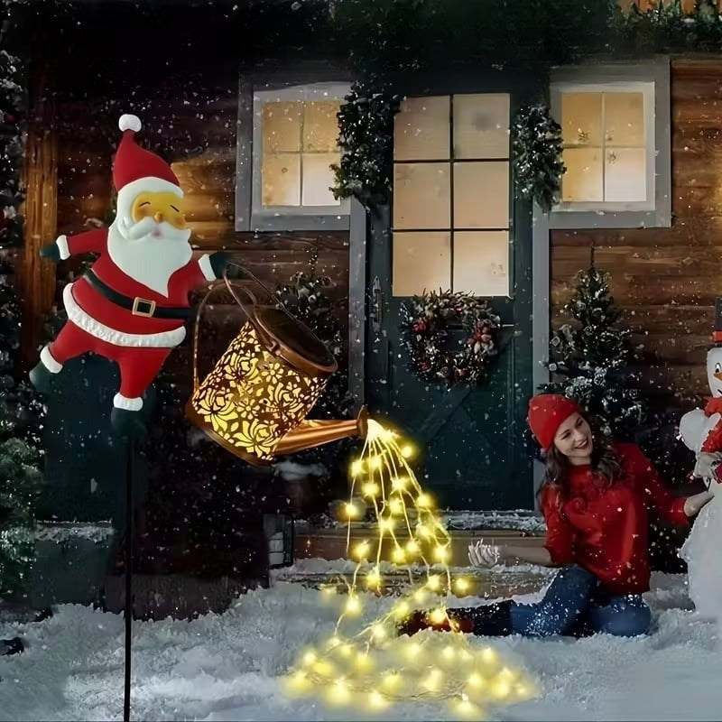 Jõuluvana kastekann päikesepatareiga ja maasse torgatava alusega